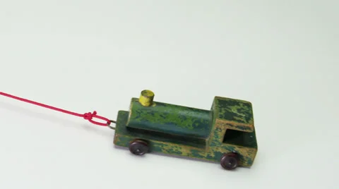 Vintage toy train on red string Vidéo 32456808