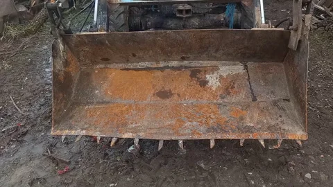 Vintage Tractor Front Loader Repeated Bucket Lift and Ground Impact with Hydraul Stock Footage 338170396