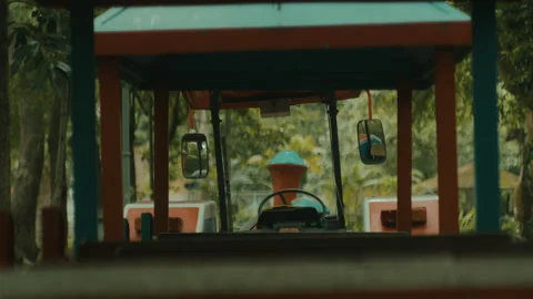 A Vintage Train Ride in a Weathered Theme Park - Close Up Stock Footage 283106283