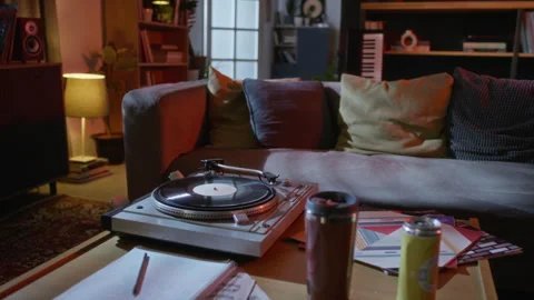 Vintage Turntable Playing Vinyl Record in Cozy Apartment Room Stock Footage 342813148