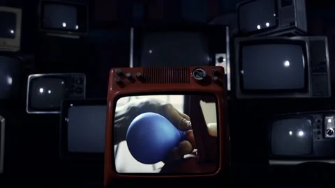 Vintage TV Explodes With Man Inflating Blue Balloon on Screen - Close Up 스톡 동영상 117660509
