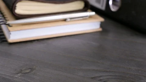 Vintage type notebook on a wooden table Stock Footage 83392394