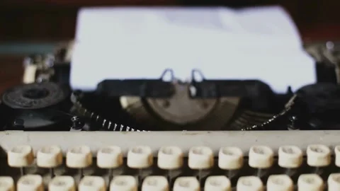 Vintage typewriter focus pull on paper Stock Footage 334108290