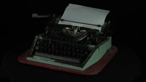 Vintage typewriter rotates on a black background loop Stock Footage 35010003