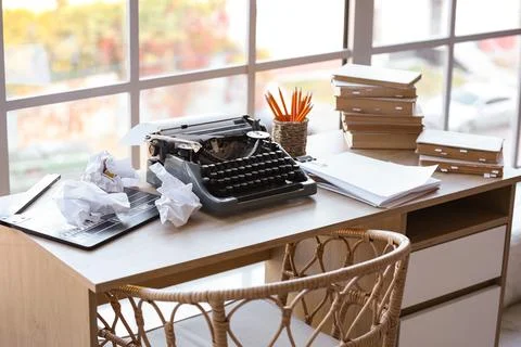 Vintage typewriter with script, movie clapper and crumpled paper on desk in s Stock Photos