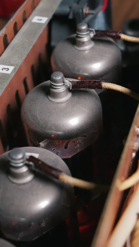Vintage Vacuum Tubes Glowing Inside a Handmade Custom Audio Amplifier Stock Footage 333826767