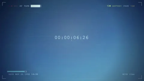 Vintage VHS Camcorder Viewfinder Interface with Blue Screen and Running Digital Stock-Footage 345758880