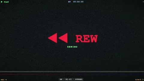Vintage VHS Rewind Screen with Red Text and Retro Analog Glitch Static Effect Stock Footage 345761560