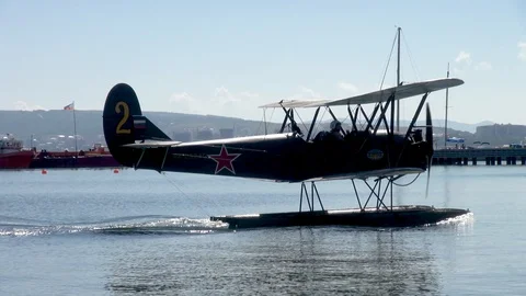 Vintage video. Seaplane U-2 / Po-2 (NATO: Mule) floats like boat in Bay. Stock Footage 121532753