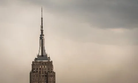 Vintage view of a skyscraper tower in a light haze of fog or smog Stock Photos
