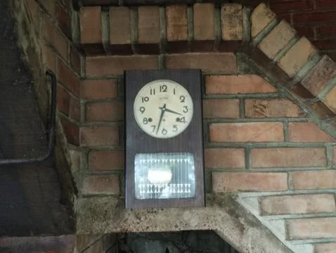 Vintage Wall Clock on Rustic Brick Background Stock Photos