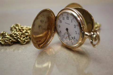 Vintage Waltham pocket watch with reflections Stock Photos