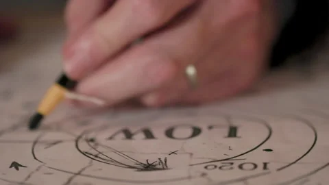 Vintage weatherman drawing data on a map Stock Footage 343990938