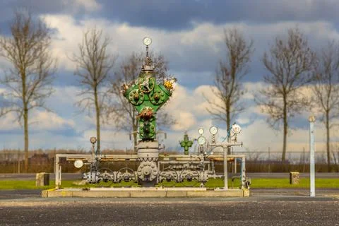 Vintage wellhead on processing site Stock Photos