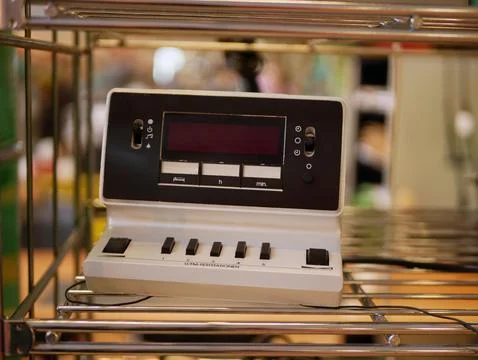 Vintage White Electronic Console With Screen And Push Buttons Showing Stock Photos