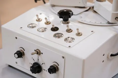 Vintage white electronics control panel with toggle switches, knobs and but.. Stock Photos