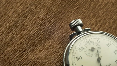 Vintage White Stopwatch on the Brown Structural Background Rotates the Arrow Stock Footage 88033499