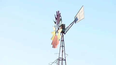 A vintage windmill spins with the wind Stock Footage 84006409