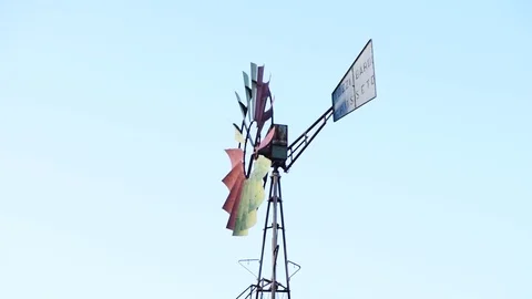 A vintage windmill spins with the wind Stock Footage 84006414