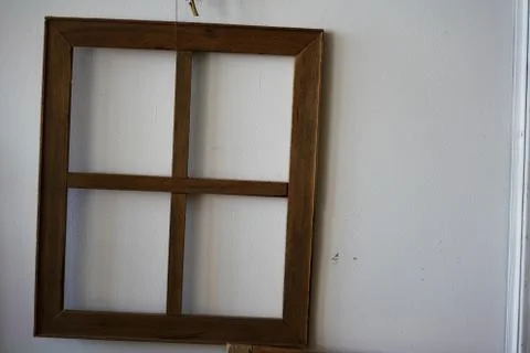 Vintage window frame without glass on old white wall Stock Photos