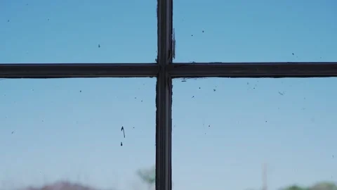 A vintage window pane framed to resemble a Christian cross Stock Footage 272617282