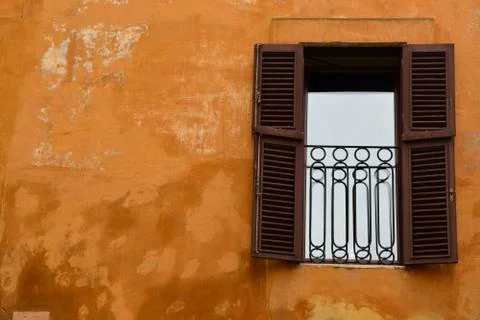 A Vintage Window with Rustic Orange Wall Stock Photos