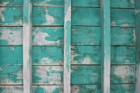 Vintage wood roof rafters with faded green paint, resulting in a rustic look for Stock Photos