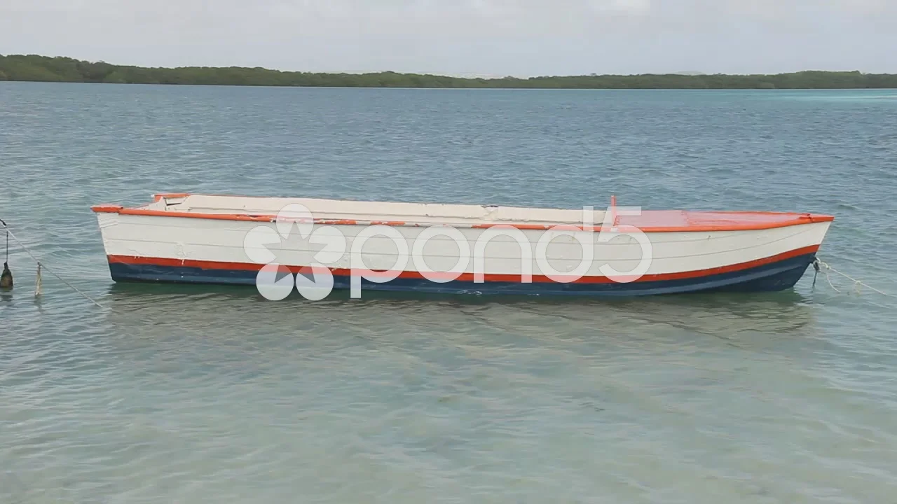 Boat rope tied to a wooden post on a floating boat railing, close