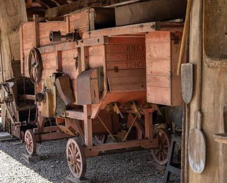 A vintage wooden threshing machine, Wojslawice Arboretum, Poland. Stock Photos