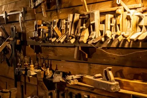 Vintage woodworking tools in a rustic workshop Stock Photos