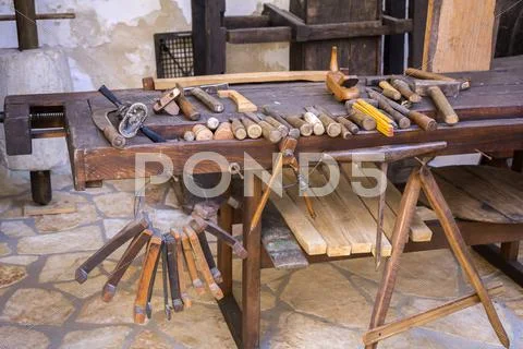 Vintage woodworking tools on a wooden workbench Stock Photos