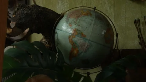 Vintage world globe with retro eclectic travel inspired interior decor Видео 336665448