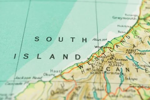 Vintage world map section highlights rugged South Island with mountainous ter Stock Photos