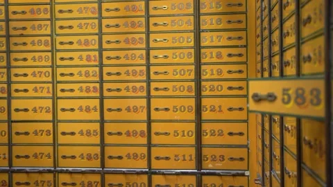 Vintage Yellow Safe Deposit Boxes in Bank Vault - Rows of Numbered Metal Lockers Stock Footage 331998155