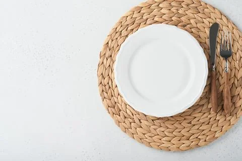 Vintage zero waste silverware. Rustic vintage set of white plate, wooden spoo Stock Photos