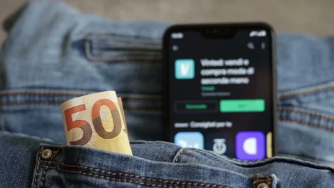 Vinted Application from the google play store, denim jeans and 50 euros. Stock Footage 150683051