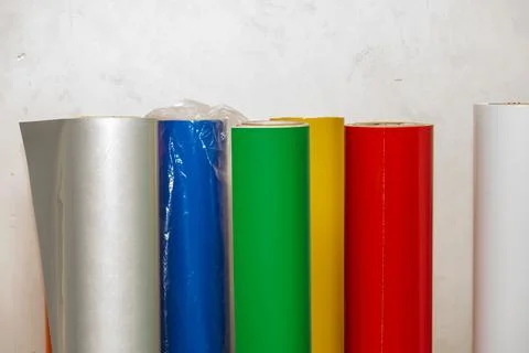 Vinyl car wrapping or plotter cutting sticker foil film rolls. Film colored i Stock Photos