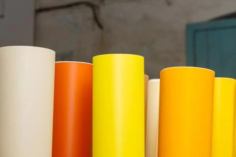 Vinyl car wrapping or plotter cutting sticker foil film rolls. Film colored i Stock Photos