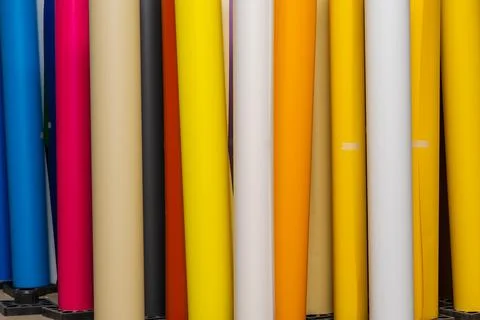 Vinyl car wrapping or plotter cutting sticker foil film rolls. Film colored i Stock Photos