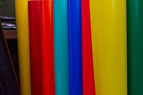 Vinyl car wrapping or plotter cutting sticker foil film rolls. Film colored i Stock Photos