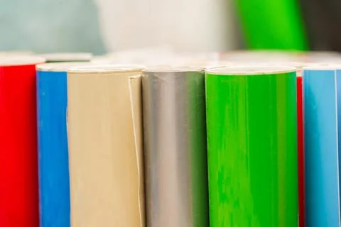 Vinyl car wrapping or plotter cutting sticker foil film rolls. Film colored i Stock Photos