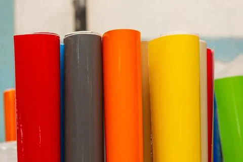 Vinyl car wrapping or plotter cutting sticker foil film rolls. Film colored i Stock Photos