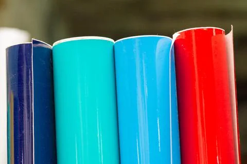 Vinyl car wrapping or plotter cutting sticker foil film rolls. Film colored i Stock Photos