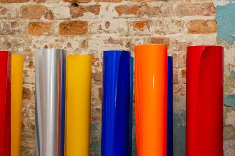Vinyl car wrapping or plotter cutting sticker foil film rolls. Film colored i Stock Photos