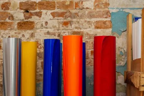Vinyl car wrapping or plotter cutting sticker foil film rolls. Film colored i Stock Photos