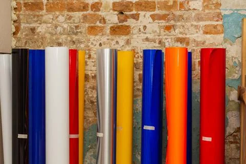 Vinyl car wrapping or plotter cutting sticker foil film rolls. Film colored i Stock Photos