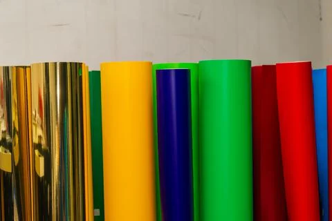 Vinyl car wrapping or plotter cutting sticker foil film rolls. Film colored i Stock Photos
