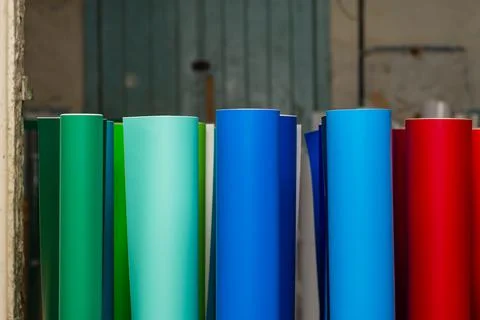Vinyl car wrapping or plotter cutting sticker foil film rolls. Film colored i Stock Photos