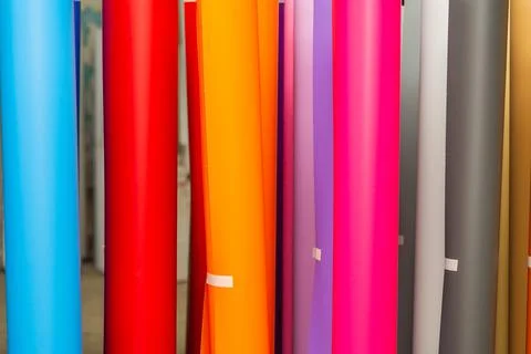 Vinyl car wrapping or plotter cutting sticker foil film rolls. Film colored i Stock Photos