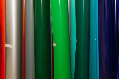 Vinyl car wrapping or plotter cutting sticker foil film rolls. Film colored i Stock Photos